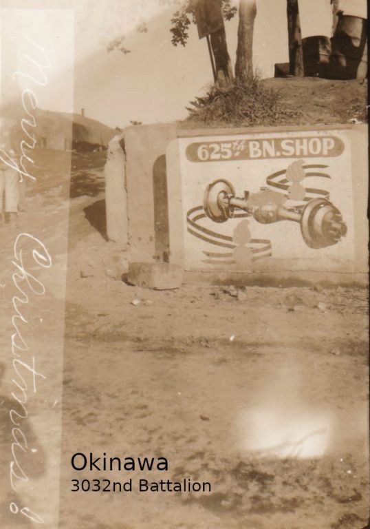 Beside his unit's sign, "625th Bn