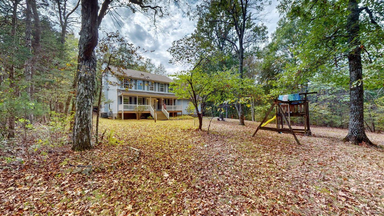 The side yard and swing set, fall 2023